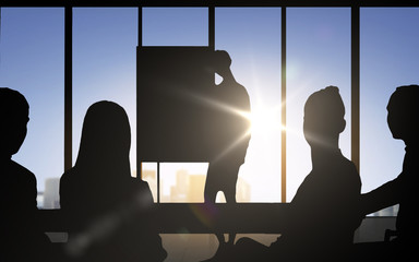 business people silhouettes at meeting in office