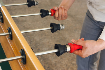 Woman playing table soccer