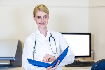 A woman vet opening her clipboard