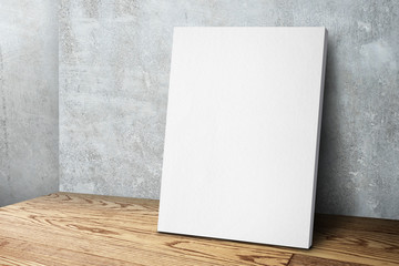 Blank white canvas frame leaning at concrete wall and wood floor - obrazy, fototapety, plakaty