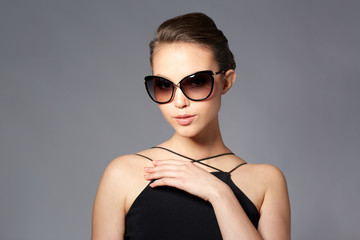beautiful young woman in elegant black sunglasses