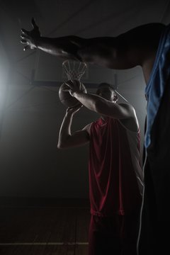 Portrait of men playing basket