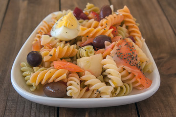 Pasta salad on wooden table