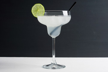 Cocktail margarita on the dark wooden background
