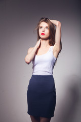 girl beautiful portrait  posing white jersey skirt white  background