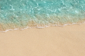 Fototapeta na wymiar Soft wave of sea on the sandy beach