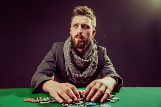 Bearded player at pocker table
