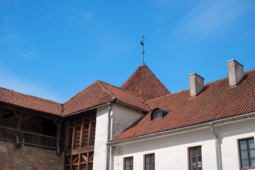 Narva, Estonia - Herman Castle. Tile roofs of buildings around the castle. Close-up.