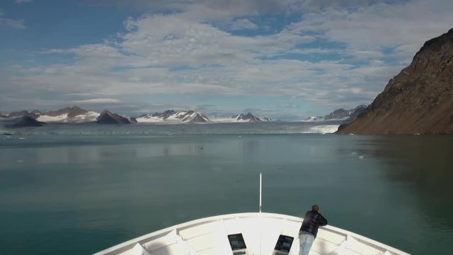 Sea mountains and large icebergs reflecting in the water.  Fantastic wonderful amazing video grenland nature iceland. Lovely shooting the life of nature, seaside and mountains.