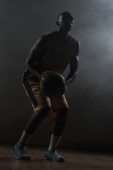 Fototapeta premium Portrait of basketball player preparing to score 