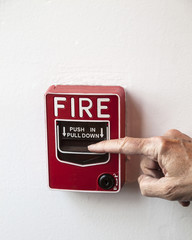 Pull Fire Alarm on Wall with Hand