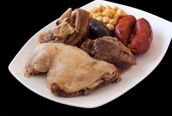 Several meats with chickpeas, chorizo and morcilla