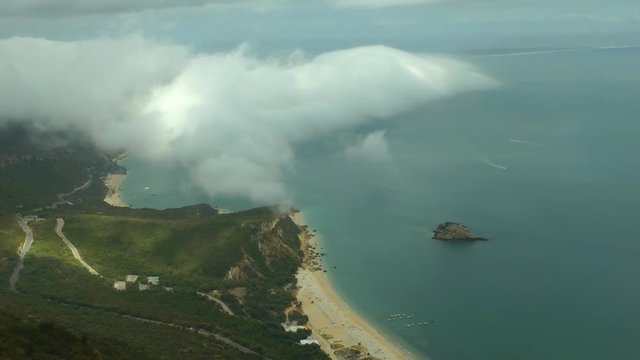 Mountain, clouds and beach in time lapse