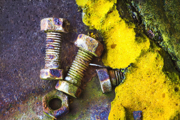 Rusty old bolts and an old polyurethane foam