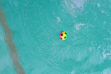 Colorful ball floating on the water