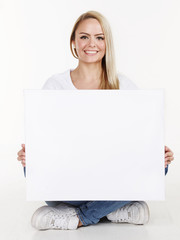 Fototapeta premium Woman with white message board