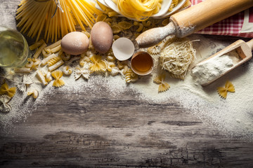 Mixed pasta with eggs and rolling pin