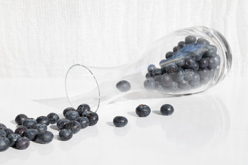 Fresh blueberries in glas bottle
