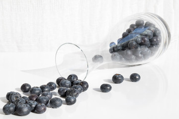 Fresh blueberries in glas bottle