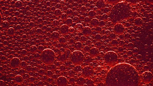Red Liquid and Bubbles in Motion