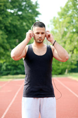 beautiful young man listening music