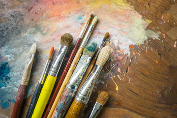 Paintbrushes on a palette
