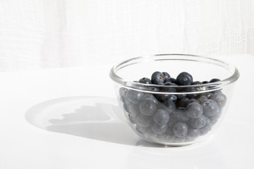Fresh blueberries in glas bottle