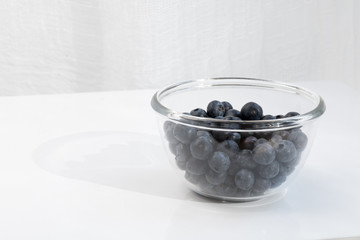 Fresh blueberries in glas bottle