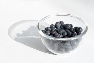 Fresh blueberries in glas bottle