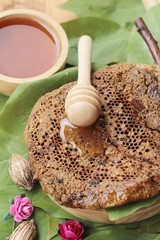 Honeycomb with the natural on green leaves.