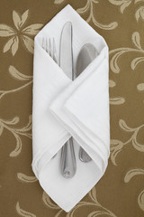 white table napkin with utensil