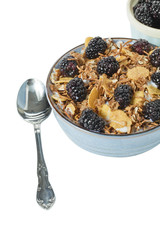cropped image of bowl of breakfast and spoon on white.