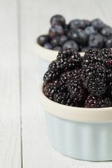 red grapes and blackberries in bowl