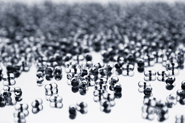 Minimalist abstract light background with transparent glass particles. The texture.