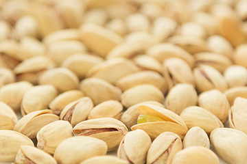 The pistachios on white background. The pistachio background.