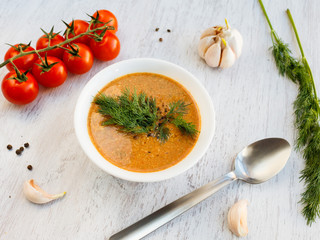 Soup and vegetables on a rustic white table