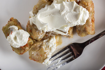 Stuffed cabbage rolls with sour cream