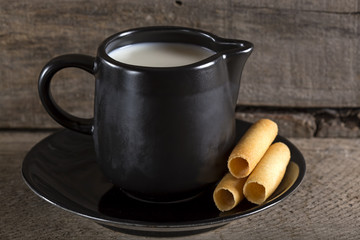 Milk cup with sweet corn rolls