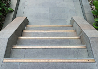 Clean stone staircas with golden strip