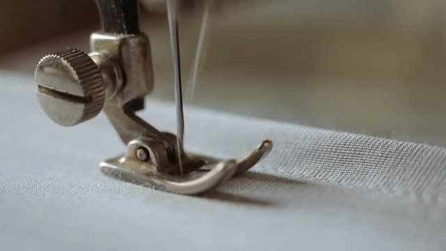 Sewing machine and item of grey clothing