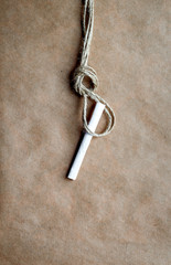 concept hangman's knot on kraft paper background with cigarette