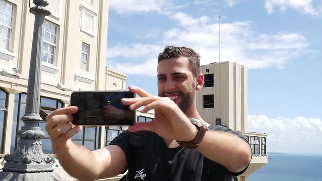 Tourist taking a selfie in Lacerda Elevator, Salvador, Bahia, Brazil