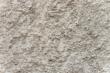 The texture of cement plaster.