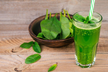 Green smoothie with spinach and mint  in glass