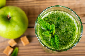 Green smoothie with spinach and apple in glass