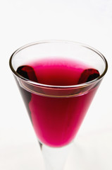 Close-up of purple drink in glass