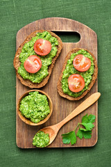 Pesto sauce and tomatoes on bread