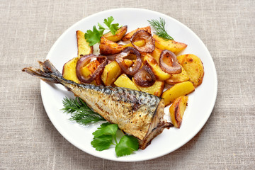Fried mackerel fish and potato wedges