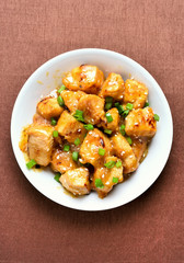Chicken meat with orange sauce