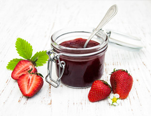 Strawberry jam and fresh strawberries